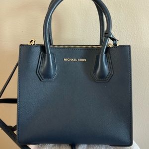 Michael Kors Navy Bag with handles and shoulder straps.